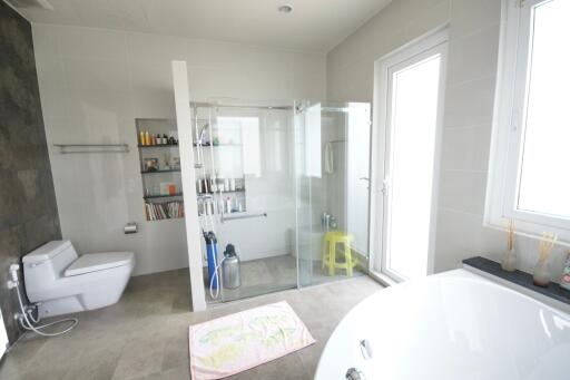 Modern bathroom with bathtub and glass shower