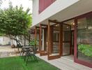 Outdoor seating area with lush greenery