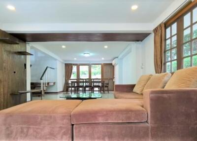 Spacious living room with modern furnishings and natural lighting