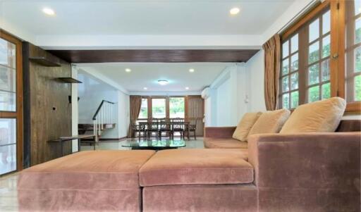 Spacious living room with modern furnishings and natural lighting