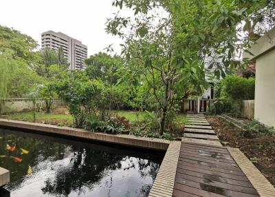 Outdoor garden with pond and walkway