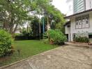 Garden with lawn and surrounding greenery