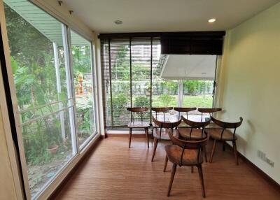 Bright dining area with large windows and garden view