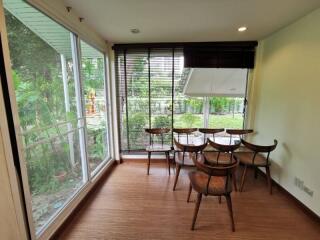 Bright dining area with large windows and garden view