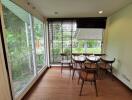 Bright dining area with large windows and garden view