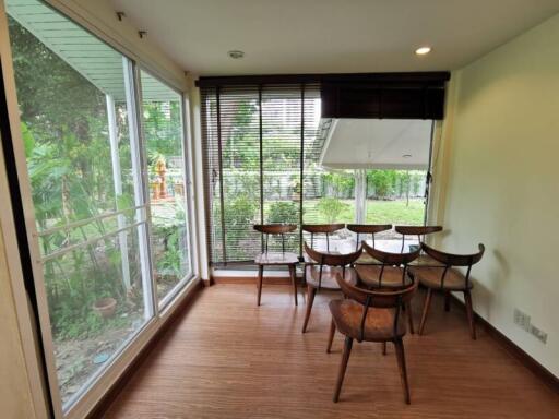 Bright dining area with large windows and garden view