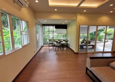 Spacious main living area with dining space and garden view