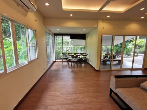 Spacious main living area with dining space and garden view