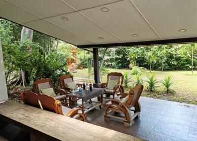 Covered outdoor patio with garden view