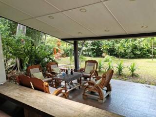 Covered outdoor patio with garden view