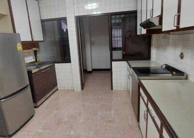 Spacious kitchen with modern appliances and ample storage