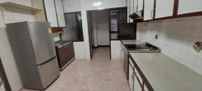 Spacious kitchen with modern appliances and ample storage