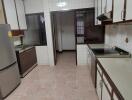 Spacious kitchen with modern appliances and ample storage