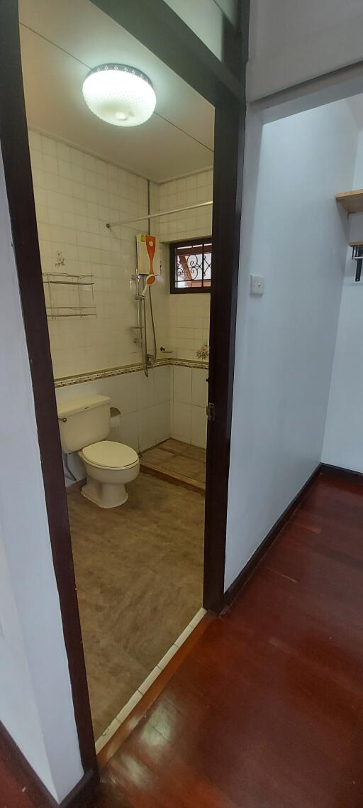 View of a bathroom through an open door