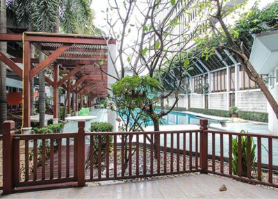 Outdoor area with pool and seating arrangements