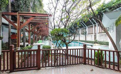 Outdoor area with pool and seating arrangements