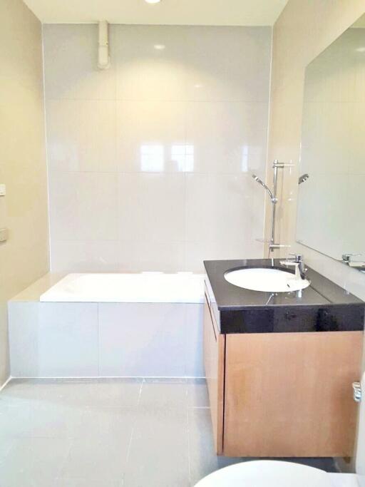 Modern bathroom with a bathtub and vanity with sink