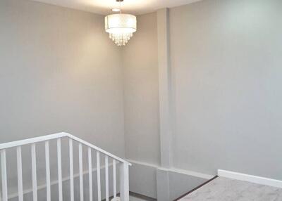 Modern indoor stairway with chandelier