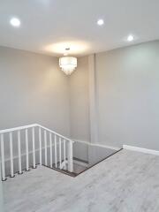 Modern indoor stairway with chandelier