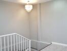 Modern indoor stairway with chandelier