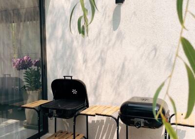 Outdoor patio with two barbecue grills