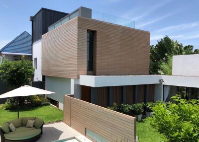 Modern house with a lush garden and patio