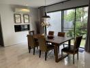 Modern dining room with wooden table and leather chairs