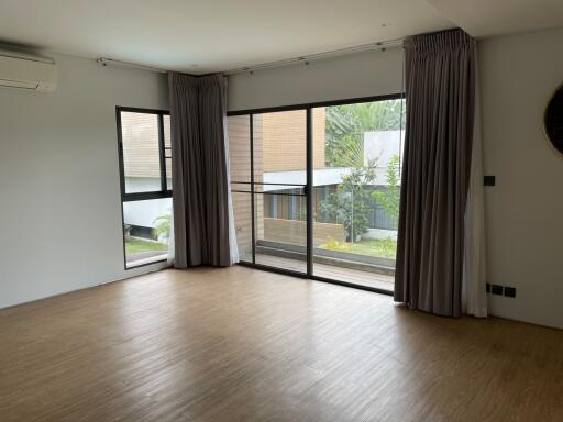 Spacious living room with large windows and a modern design