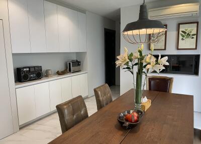 Modern kitchen with dining area and appliances