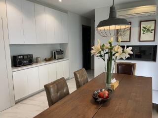 Modern kitchen with dining area and appliances