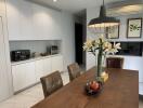 Modern kitchen with dining area and appliances