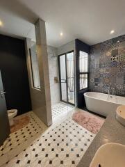 Modern bathroom with bathtub and shower