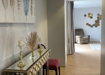 Elegant decorated hallway leading to a sitting area