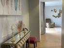 Elegant decorated hallway leading to a sitting area