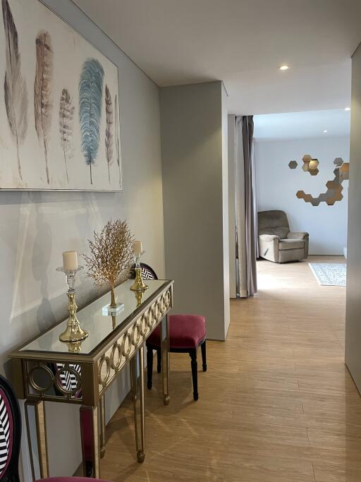 Elegant decorated hallway leading to a sitting area