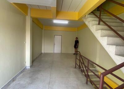 Interior view of a building with staircases and open floorspace