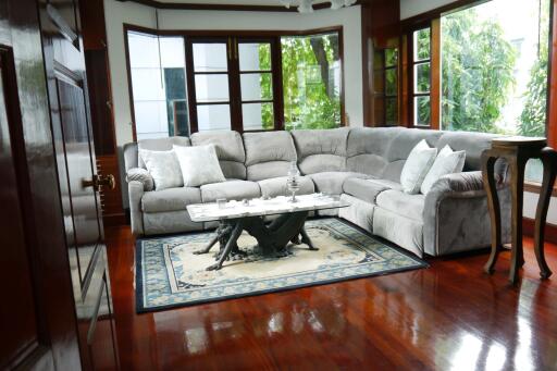 Spacious living room with large L-shaped sofa and coffee table