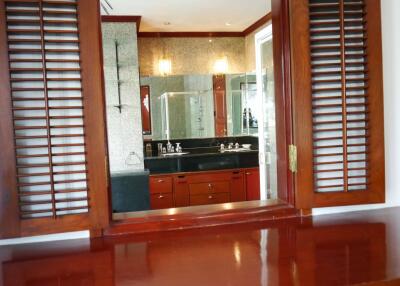 Modern bathroom with wooden shutters and granite countertops