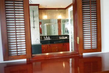 Modern bathroom with wooden shutters and granite countertops