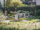 Beautifully landscaped garden with a birdbath and bench seating