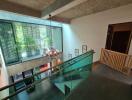 Modern atrium with chandelier and glass railings