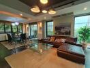 Modern living room with leather sofa and glass coffee table