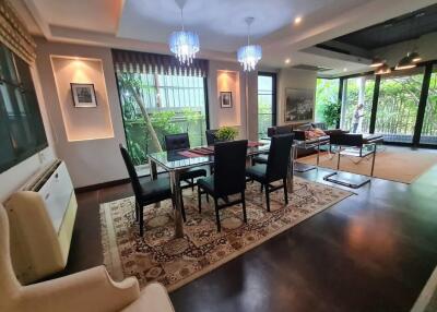 Spacious living and dining area with modern decor and large windows