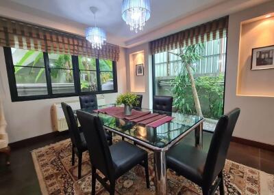 Elegant dining room with modern furniture and large windows