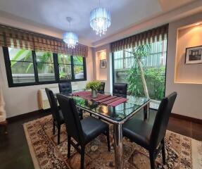 Elegant dining room with modern furniture and large windows