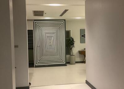 Modern hallway with abstract wall art