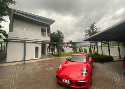 Modern house exterior with car in driveway