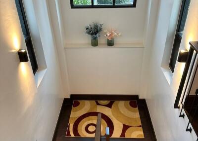 Well-lit staircase with decorative elements