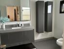 Modern bathroom with large mirror and sleek cabinets