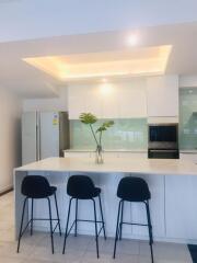 Modern kitchen with island and bar stools